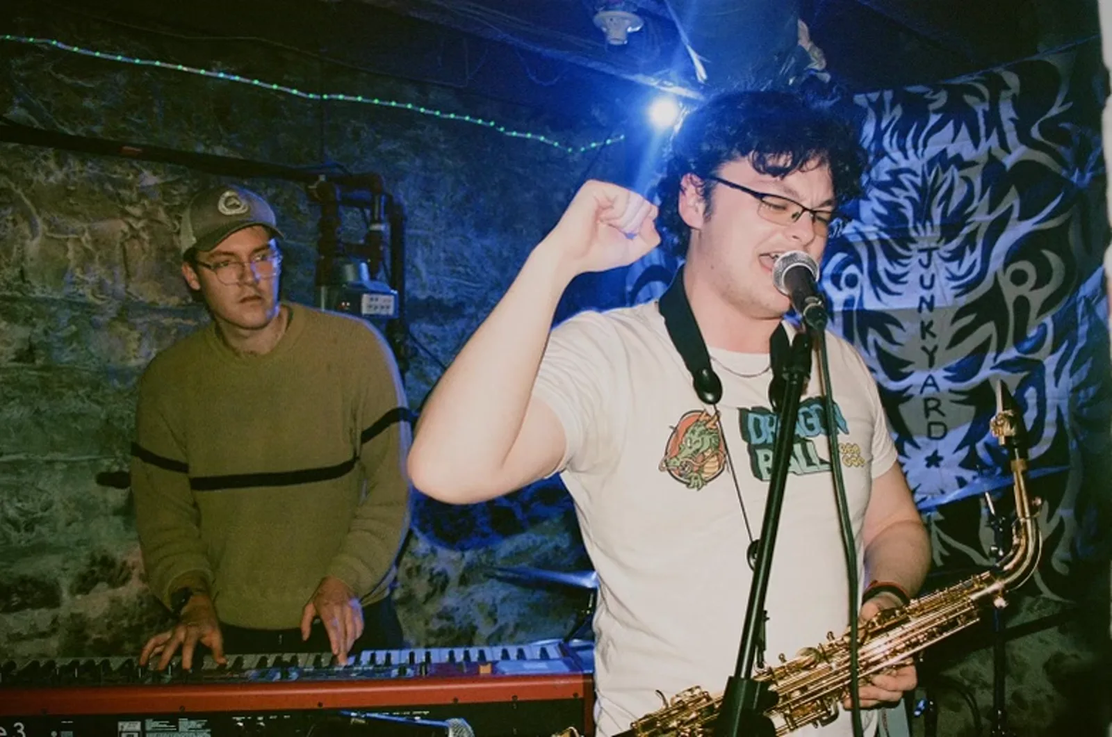 Jack Hansen playing keys behind a saxophone player at a gig
