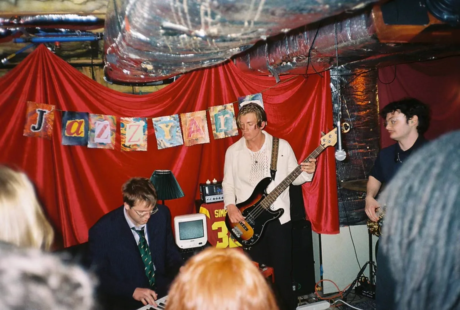 Jack Hansen at the piano with a bassist and saxophone player